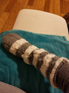 finger ulcer | Scleroderma News | Lisa Weber shows the sock she wore on her hand to help ease the pain of her finger ulcer