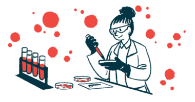 A scientist works with blood samples in a laboratory using petri dishes.